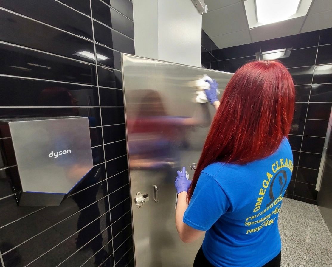 Staff cleaning restroom